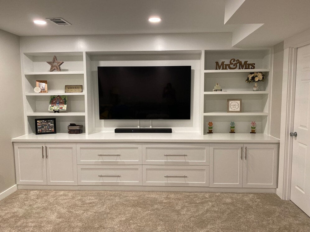 custom built-in wall shelving and cabinets in a basement remodel in grand rapids mi