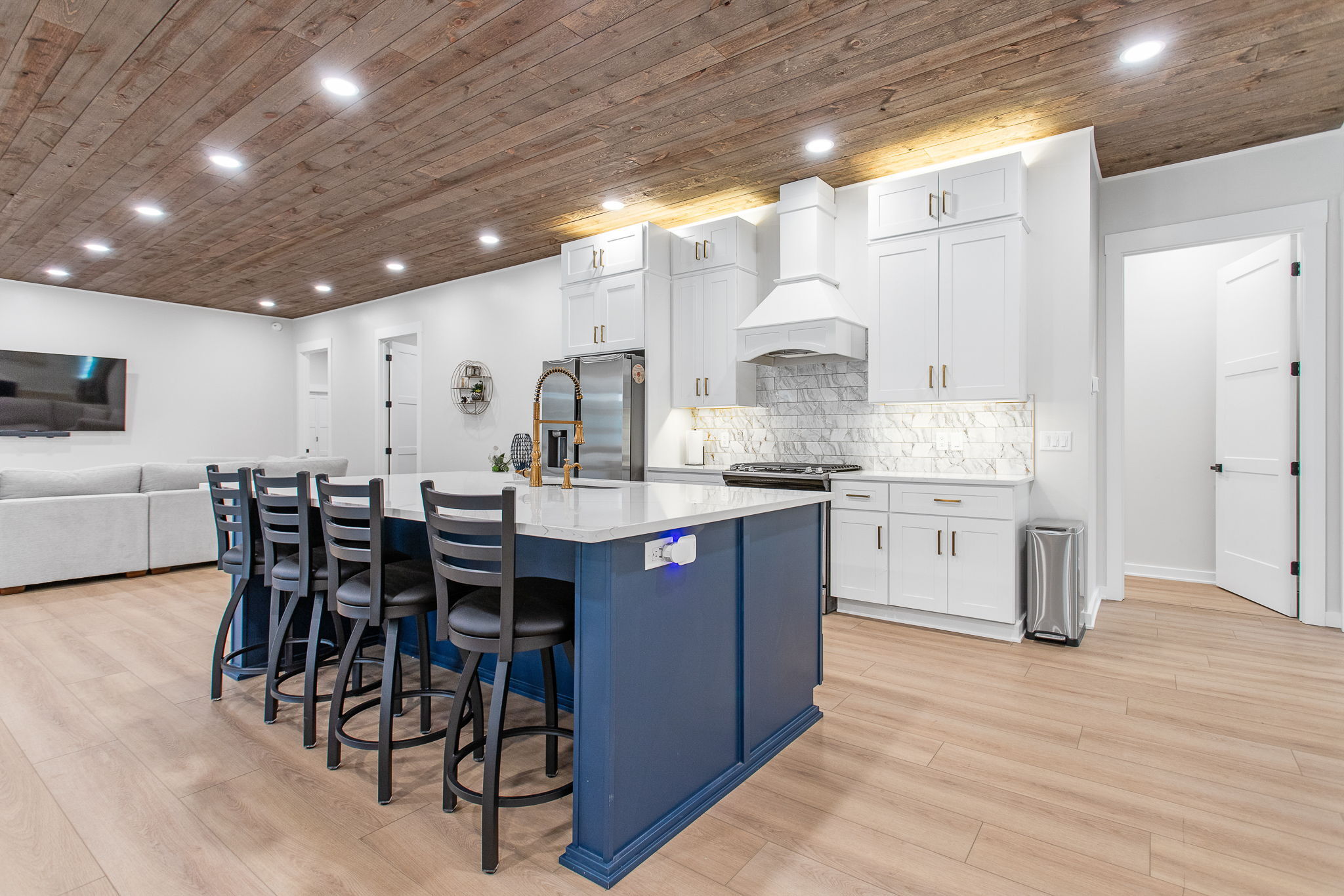 kitchen remodel with blue island and white cabinets